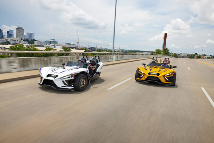 2024_Polaris_Slingshot_R_Models_in_Purple_Lightning_and_Gold_Rush.jpg